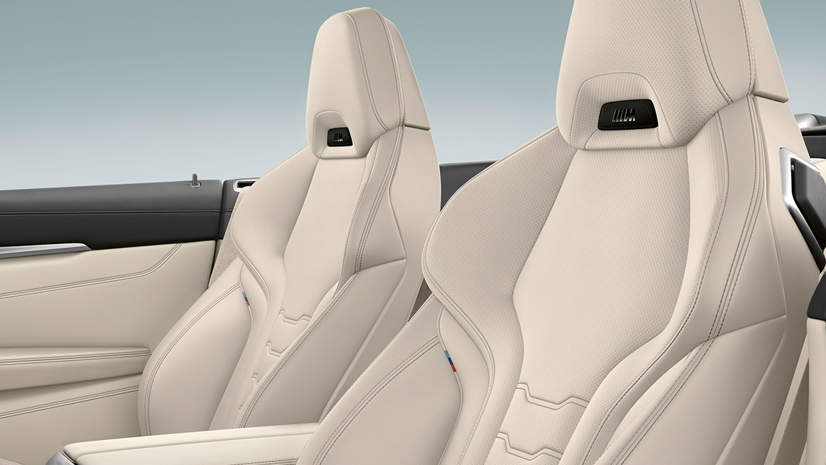 BMW M850i xDrive, multifunktionssæder i "Merino"-læder i Ivory White med nakkevarme. BMW M850i xDrive, multifunktionssæder i "Merino"-læder i Ivory White med nakkevarme.