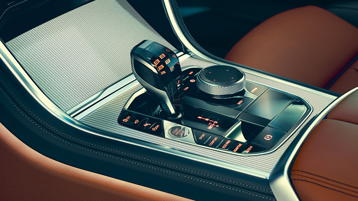 BMW 8-serie Coupé, midterkonsol. Nærbillede af kabinen i BMW 8-series Coupé med fokus på midterkonsollen.